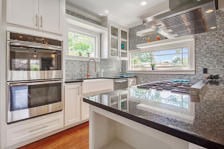 An image of a modern kitchen with sleek appliances, featuring a gas stove, refrigerator, and built-in microwave in Brooklyn